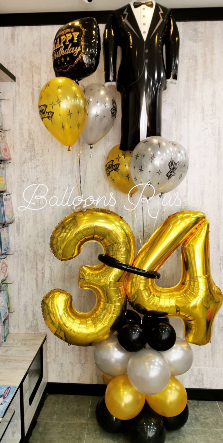 birthday arrangement with tuxedo balloon