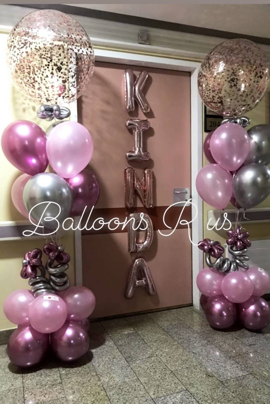 TWO STANDS OF CONFETTI AND CHROME BALLOONS