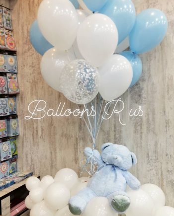 teddy bear with pastel balloons
