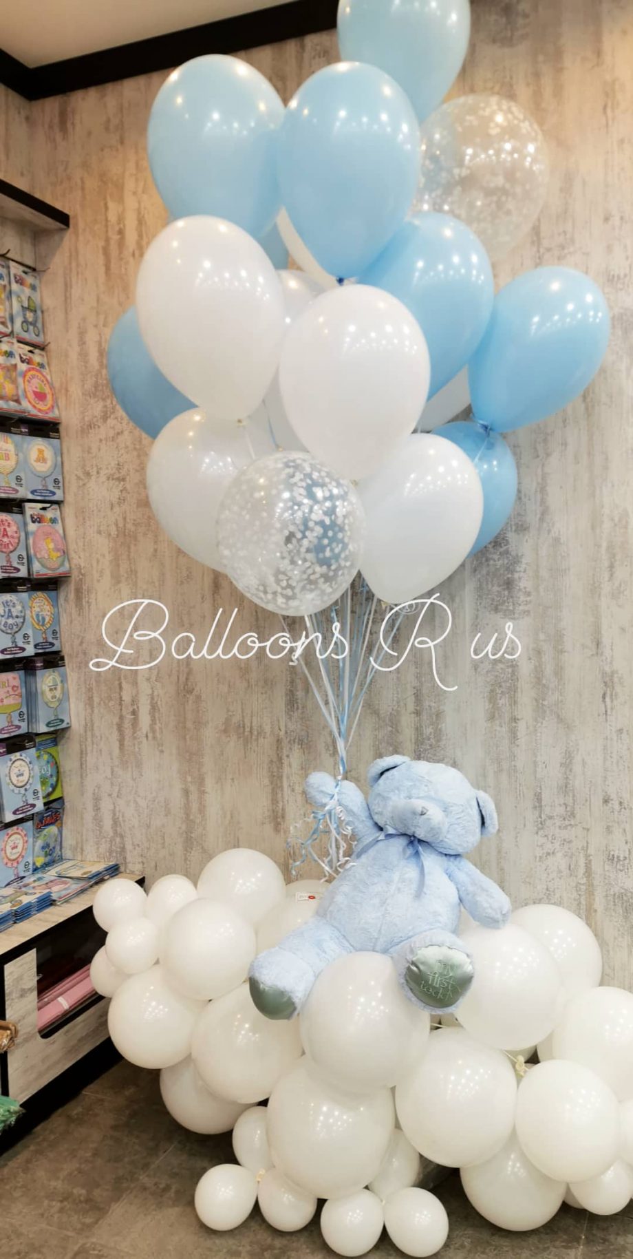teddy bear with pastel balloons