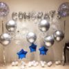 graduation setup of chrome and confetti balloons
