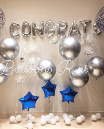 graduation setup of chrome and confetti balloons