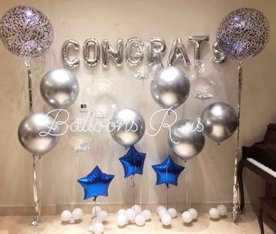 graduation setup of chrome and confetti balloons