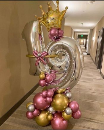 Aged arrangement of chrome balloons