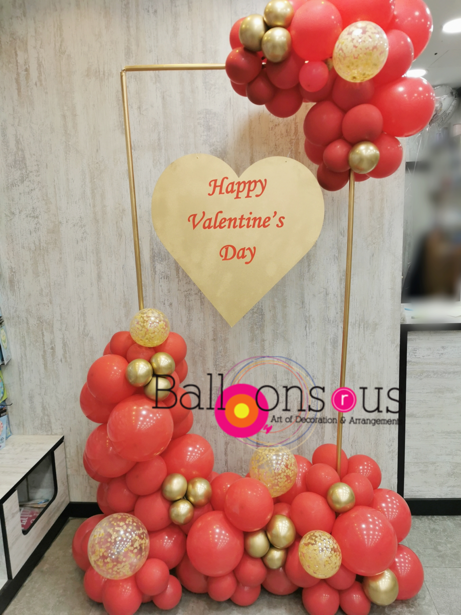 Stand of balloons with wood heart frame