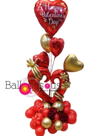 Gold and red arrangement with 10 artificial flowers attached
