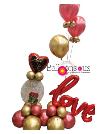 Arrangement of love with artificial flowers inside clear balloon
